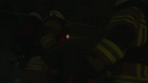 Multiple Firefighters Walk Down Hallway With Flashlights Stock Footage 266408786