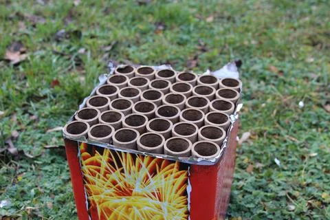 Multiple fireworks tubes arranged on a grass field ready for celebration Stock Photos