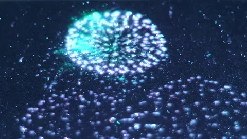 Multiple flashes of fireworks are projected onto a shiny, sparkling surface Video stock 313213151