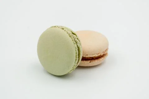 Multiple flavor Cake macaron or macaroon on turquoise macros on a white backg Stock Photos