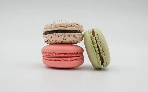 Multiple flavor Cake macaron or macaroon on turquoise macros on a white backg Stock Photos