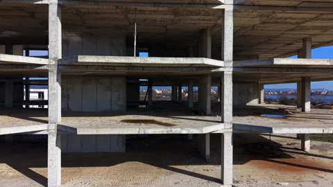 Multiple floors of concrete framework overlook white villa, Pomorie Stock-Footage 339665779