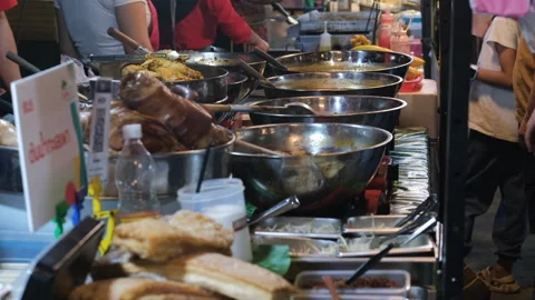 Multiple food stalls at Thai night market Stockbeeldmateriaal 338273071
