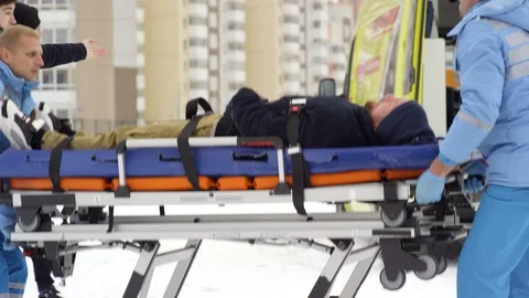 Multiple Footages of Paramedics Loading Patient into Ambulance Stock Footage 123690812