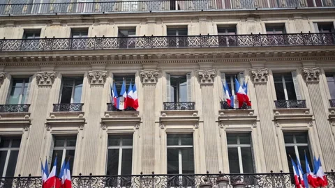 Multiple French flags hanging on a building in Paris, France Stock Footage 278088215