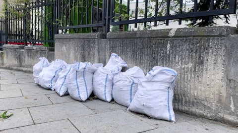 Multiple garbage bags left at the sideway Stock Footage 141541341