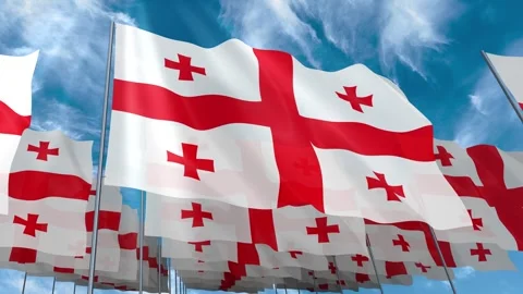 Multiple Georgia flags seamless looping waving on blue sky Stock Footage 343680632