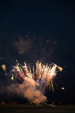 Multiple golden fireworks Stock Photos