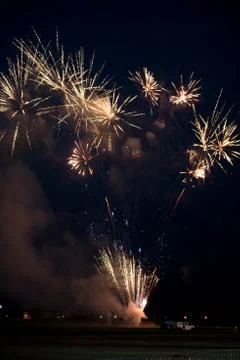 Multiple golden fireworks Stock Photos
