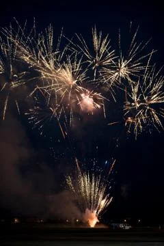 Multiple golden fireworks Stock Photos