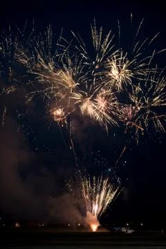 Multiple golden fireworks Stock Photos