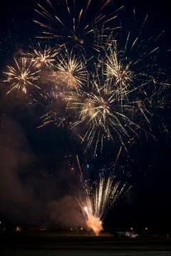 Multiple golden fireworks Stock Photos