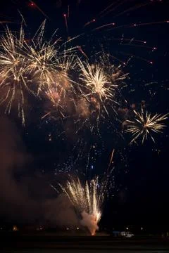 Multiple golden fireworks Stock Photos