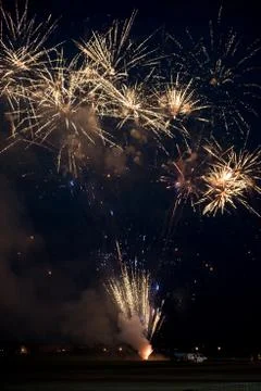 Multiple golden fireworks Stock Photos