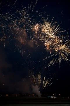Multiple golden fireworks Stock Photos