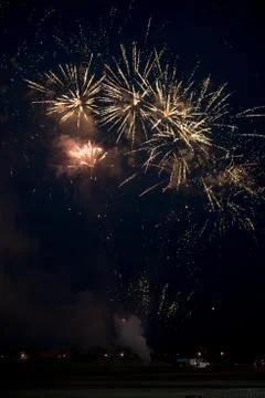 Multiple golden fireworks Stock Photos