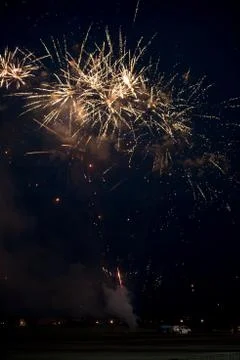 Multiple golden fireworks Stock Photos