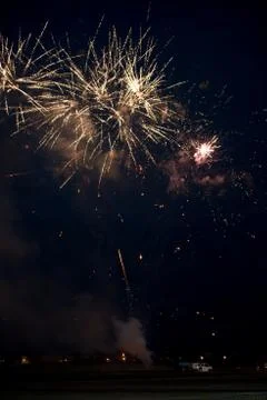 Multiple golden fireworks Stock Photos