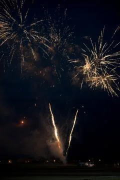 Multiple golden fireworks Stock Photos