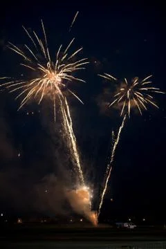 Multiple golden fireworks Stock Photos