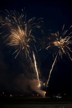 Multiple golden fireworks Stock Photos