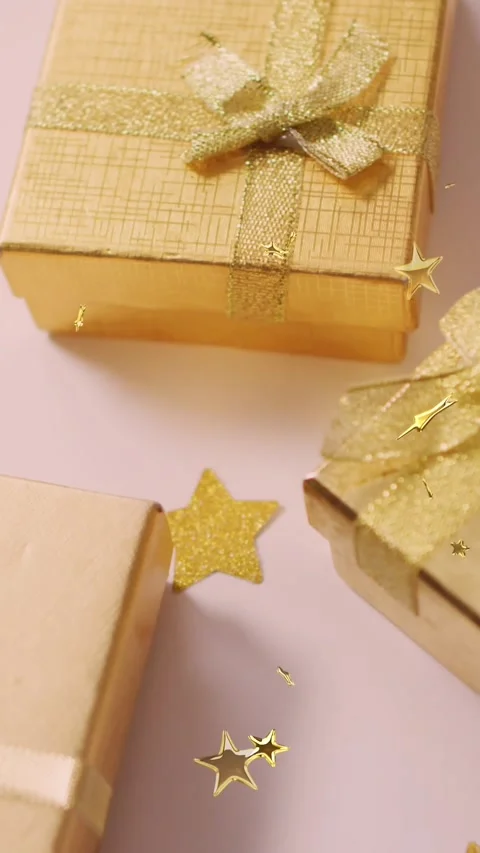 Multiple golden star icons floating against christmas gifts on white surface Stock Footage 342136845