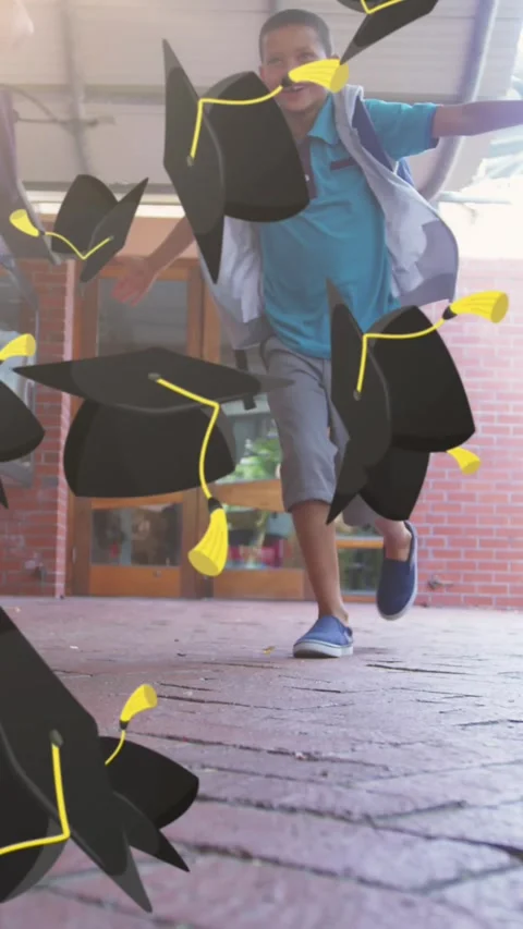 Multiple graduation hat icons falling against group of kids running in school Stock Footage 343545456