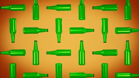 Multiple green glass beer bottles rotating in the orange abstract background Stock Footage 197352269