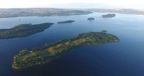Multiple Green Scottish Islands and Lake Drone Shot 스톡 동영상 97571895