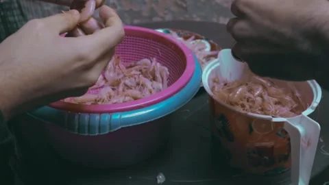 Multiple Hands Deveining Shrimp Over Buckets Stock Footage 299577537