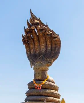 Multiple head naga statue watching under blue sky Stock Photos