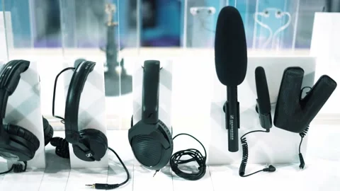 Multiple Headphones &amp; Mic are Hanging on the Rod Stock Footage 231350371