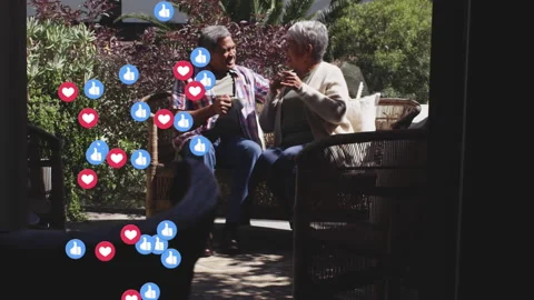 Multiple heart and thumbs up icons floating against african american couple Video stock 150223090