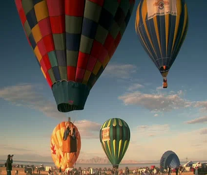 Multiple hot-air balloons ascend into the sky Stock Footage 21655915