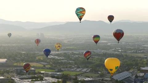 Multiple Hot Air Balloons at Hazy Sunrise in Reno Stock Footage 316700143
