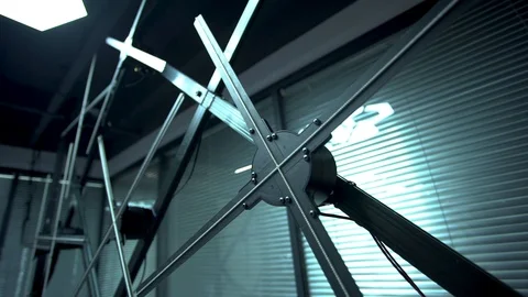 Multiple huge holographic fans with multiple led strips placed on a black Stock Footage 96225512