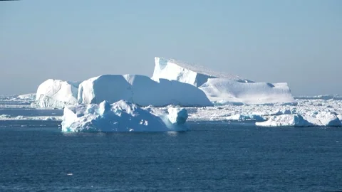 Multiple icebergs drifting wide ocean Antarctica, 4K Stock Footage 332372885