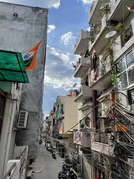 Multiple Indian Flags Wave Proudly from Balconies of Delhi Streets Stock Photos