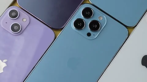 Multiple iPhones Arranged Together on Table Stock Footage 343428316