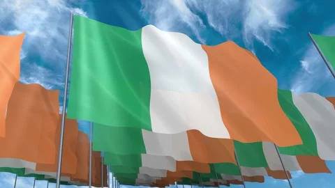 Multiple Ireland flags seamless looping waving on blue sky Stock Footage 343681656