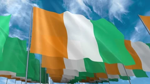 Multiple Ivory Coast flags seamless looping waving on blue sky Stock Footage 343681741