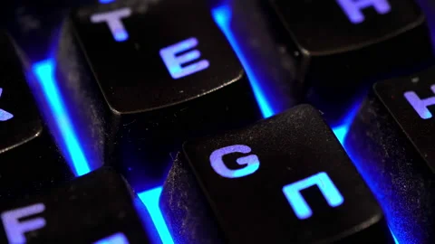Multiple keyboard keys changing colors close-up Video stock 144024639