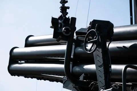 Multiple launch rocket system barrels, close-up, military equipment Stock Photos