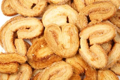 Multiple layered shortbread cookies on white isolated background Stock Photos