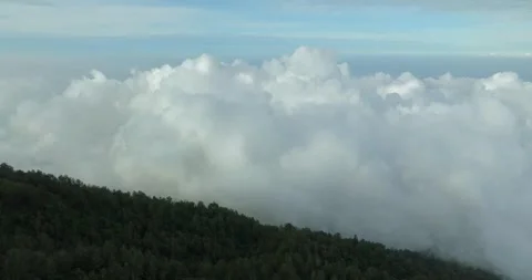 Multiple layers of clouds. View of Agung volcano slope in Bali island. Stock Footage 245529689