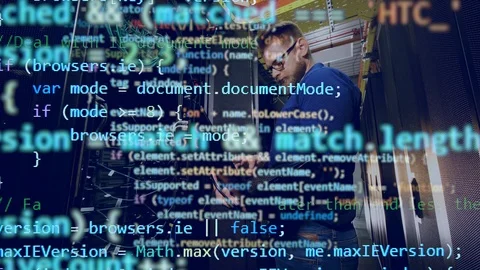 Multiple layers of codes and the male programmer shown beneath them Stock Footage 114738881