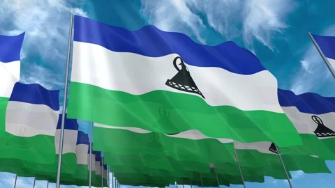 Multiple Lesotho flags seamless looping waving on blue sky Stock Footage 343682230