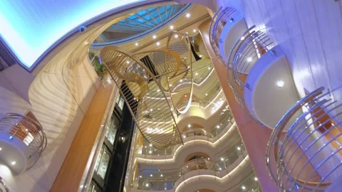 Multiple level atrium on cruise ship showing glass elevator and lighting Stock Footage 233398309
