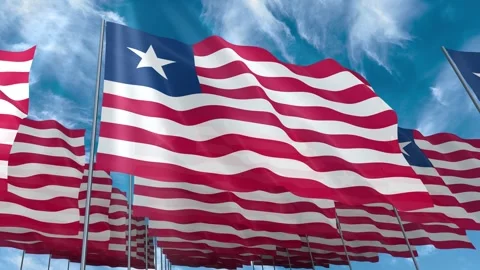 Multiple Liberia flags seamless looping waving on blue sky Stock Footage 343682412