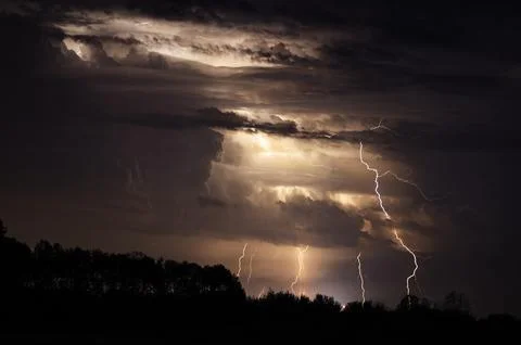 Multiple lightining thunder storm at night Stock Photos